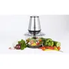 A food chopper with vegetables arranged around it. Produktbild-Vorschau