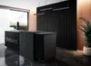 A modern reception area with a black reception desk and a slatted black wall. Náhled obrázku produktu