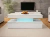A modern white coffee table with blue LED lighting in a living room setting. Produktbild-Vorschau