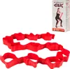 A red TheraBand CLX fitness band is shown laid out in loops, with its packaging in the background. Produktbild-Vorschau