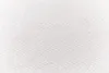 A close-up view of a white fabric with a herringbone pattern. Produktbild-Vorschau