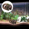 An aquarium with a decorative log. Produktbild-Vorschau