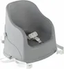 A gray baby booster seat with white straps is shown against a white background. Náhled obrázku produktu
