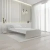 A minimalist bedroom scene with a white bed. Náhled obrázku produktu