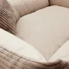 A close-up view of a soft, plush dog bed with corduroy accents. Náhled obrázku produktu