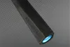 Close-up of the end of a black, hexagonal object with a blue light emanating from it. Produktbild-Vorschau