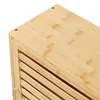 Close-up view of the top corner and side of a wooden cabinet with slatted doors. Podgląd zdjęcia produktu