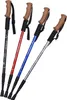 Four hiking poles of different colors arranged diagonally on a white background. Náhled obrázku produktu