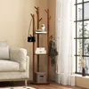 A wooden coat rack with shelves is shown in a room next to a sofa and a window with sheer curtains. Anteprima dell’immagine prodotto