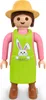 A Playmobil figure of a gardener wearing a yellow hat and a green apron with a bunny print. Podgląd zdjęcia produktu