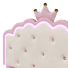 A close-up view of a pink and white upholstered headboard with a crown detail and LED lighting. Podgląd zdjęcia produktu