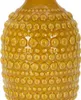 A close-up view of a textured yellow vase. Anteprima dell’immagine prodotto