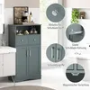 A gray bathroom cabinet with two doors and two drawers, placed in a bathroom setting next to a toilet and sink. Inset circles highlight the cabinet's features. Náhled obrázku produktu