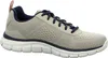 A side view of a beige athletic shoe with navy blue laces and trim. Voir les images du produit