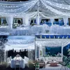 A collage of four images showcasing white string lights used for decoration in various settings: an indoor event space, an outdoor garden party, and a patio. Produktbild-Vorschau