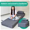 A young woman sits cross-legged on a folded mattress, with a folded mattress and pillow shown in a circular inset. Voir les images du produit