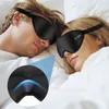 A couple sleeping in bed, both wearing black sleep masks. Anteprima dell’immagine prodotto