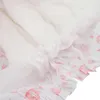 Close-up view of a disposable dog diaper, showing the ruffled edges and absorbent material. Produktbild-Vorschau