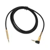 A black audio cable with gold connectors is laid out on a white background. Náhled obrázku produktu