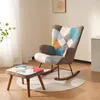 A patchwork rocking chair with a matching ottoman in a living room setting. Podgląd zdjęcia produktu