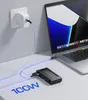 A laptop, a docking station, and a power adapter are connected by cables on a desk. Produktbild-Vorschau