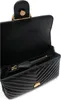 A black quilted handbag is shown open, revealing its interior. Voir les images du produit