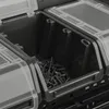 A close-up view of a black plastic storage box with clear lids, filled with screws. Náhľad obrázku produktu