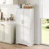 A white kitchen cabinet with double doors stands next to a window with blinds, in a kitchen setting. Anteprima dell’immagine prodotto