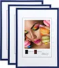 Three blue picture frames are stacked on top of each other, with the front frame displaying a close-up image of a woman's face with colorful makeup and macarons. Produktbild-Vorschau