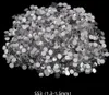 A pile of small, clear and silver rhinestones on a black background. Náhľad obrázku produktu