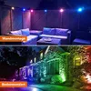 A split image showing two different ways to install outdoor LED garden lights. The top half shows lights mounted on a fence above outdoor furniture, and the bottom half shows lights installed in the ground illuminating a house. Náhled obrázku produktu