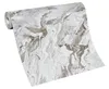 A roll of wallpaper with a marble-like pattern. Podgląd zdjęcia produktu