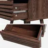 Close-up views of a wooden drawer and its interior, showcasing the ribbed texture of the drawer front and the smooth wood grain inside. Produktbild-Vorschau