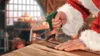 Santa Claus is using a hacksaw to cut a metal rod on a wooden workbench in a workshop setting. Produktbild-Vorschau