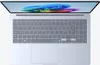 A top-down view of an open laptop with its screen displaying a colorful abstract image. Produktbild-Vorschau