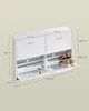 A white shoe cabinet with dimensions shown, featuring two drawers and flip-down shoe storage compartments. Náhled obrázku produktu