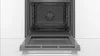 An open oven with the interior visible. Produktbild-Vorschau
