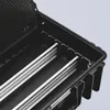Close-up view of the interior of an open black tool case with silver rails. Voir les images du produit