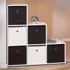A modular storage unit with black and white fabric bins. Produktbild-Vorschau