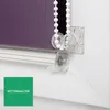 A close-up view of a roller blind mechanism, showing the chain and its holder. Produktbild-Vorschau