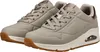 A pair of gray Skechers sneakers with white soles and brown accents. Produktbild-Vorschau