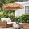 An outdoor patio scene with wicker furniture and a thatched umbrella. Náhled obrázku produktu