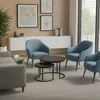 A modern living room setting with blue armchairs and a coffee table. Voir les images du produit