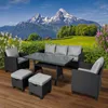 A polyrattan garden seating set is arranged on a wooden deck with a scenic mountain landscape in the background. Produktbild-Vorschau