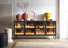 A modern living room with a sideboard filled with glassware and decorative items, illuminated by LED lights. Voir les images du produit