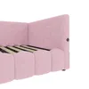 A close-up side view of a pink upholstered bed frame with a hexagonal pattern on the headboard. Produktbild-Vorschau