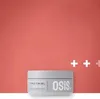 A product shot of a hair styling gel jar against a coral background with white plus signs. Anteprima dell’immagine prodotto