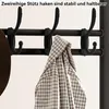 A close-up of a black coat rack with multiple hooks, one of which is holding a patterned shirt. The text "Zweireihige Stütz haken sind stabil und haltbarer" is overlaid at the top. Produktbild-Vorschau
