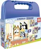 A blue puzzle box with images of Bluey characters on the front, showing four different puzzles with varying piece counts. Náhled obrázku produktu