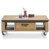 A coffee table with a drawer and shelving, placed on casters. Produktbild-Vorschau